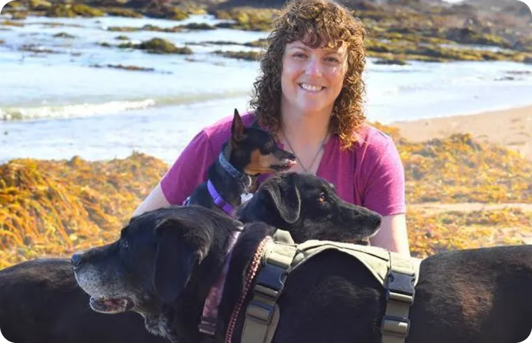 Brittany working with a dog during an in-home session